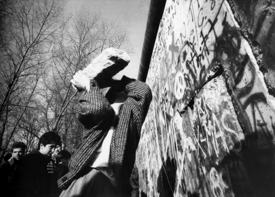 An undated photo of people bringing down the Berlin Wall. (SPH Media)