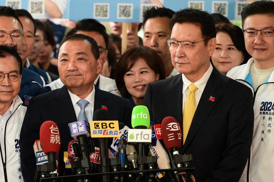 Hou You-yi (left), Taiwanese presidential candidate from the main opposition party Kuomintang (KMT), and his KMT running mate Jaw Shaw-kong speak to the media after they registered for the upcoming 2024 presidential elections at the Central Elections Commission in Taipei on 24 November 2023. (Sam Yeh/AFP)