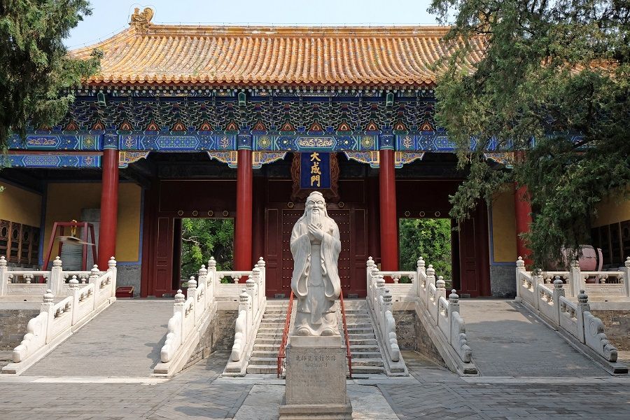 The statue of Confucius stands in front of the gate of Confucius Temple in Beijing, China. (iStock)