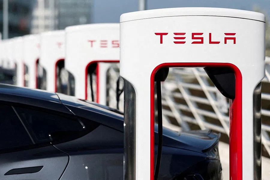 The logo of Tesla is pictured at a Tesla Super Charging station in Saint-Herblain near Nantes, France, on 27 March 2025. (Stephane Mahe/Reuters)