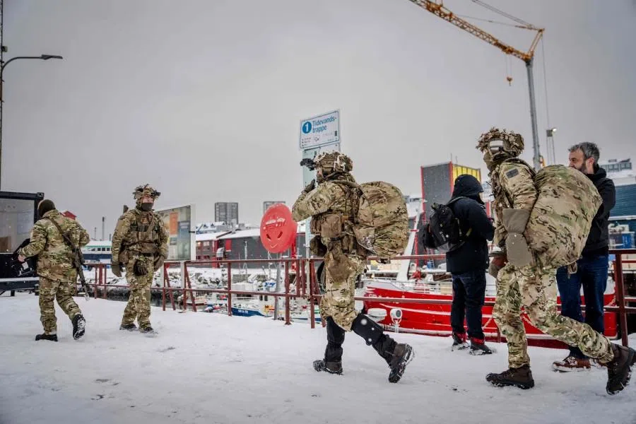 Danish soldiers disembark at the port in Nuuk, Greenland, on 18 January 2026. The Danish Defence will continue the increased presence with exercise activities together with a number of NATO allies in and around Greenland in 2026, in cooperation with the Greenlandic authorities and the Greenlandic government, Naalakkersuisut, as stated by the Danish Defence. (Mads Claus Rasmussen/AFP)