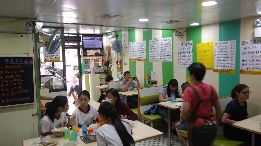 A caa caan teng at non-peak hours. During peak hours strangers share tables. This one had about three wait staff, including one doubling up as a cashier (Lian-Hee Wee)
