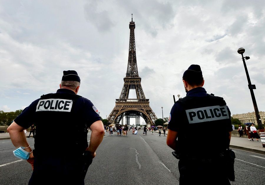 French police officers stand guard in front of the Eiffel tower in Paris, France, 4 September 2021. (Eric Gaillard/Reuters)