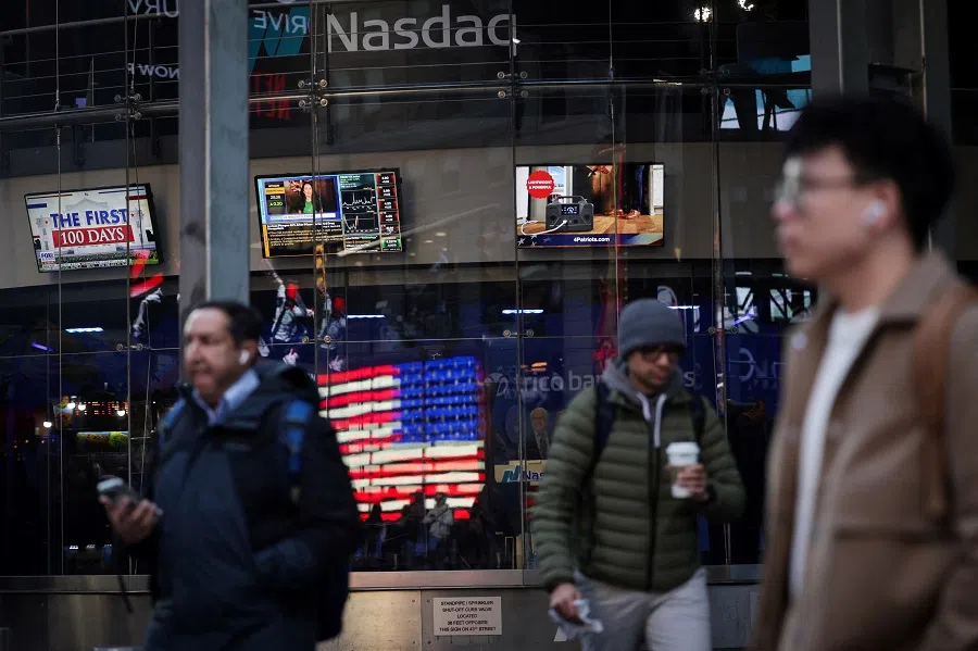 People walk past the Nasdaq MarketSite in New York City, US, on 11 March 2025. (Mike Segar/Reuters)