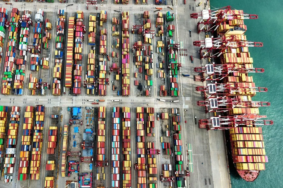 A ship is seen at the container terminal of the port in Qingdao, in China’s eastern Shandong province on 9 October 2025. (AFP)