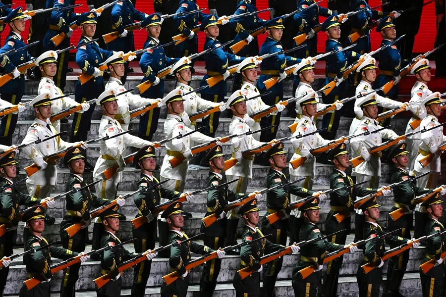 Artists take part in a performance at the Great Hall of the People, following a military parade marking the 80th anniversary of victory over Japan and the end of World War II, in Beijing on 3 September 2025. (Wang Zhao/AFP)