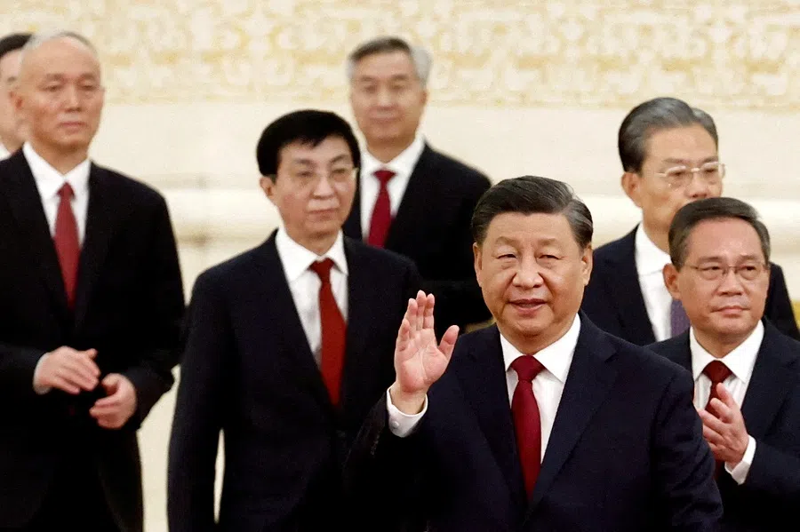 New Politburo Standing Committee members Xi Jinping, Li Qiang, Zhao Leji, Wang Huning, Cai Qi, Ding Xuexiang and Li Xi arrive to meet the media following the 20th National Congress of the Communist Party of China, at the Great Hall of the People in Beijing, China, 23 October 2022. (Tingshu Wang/Reuters)
