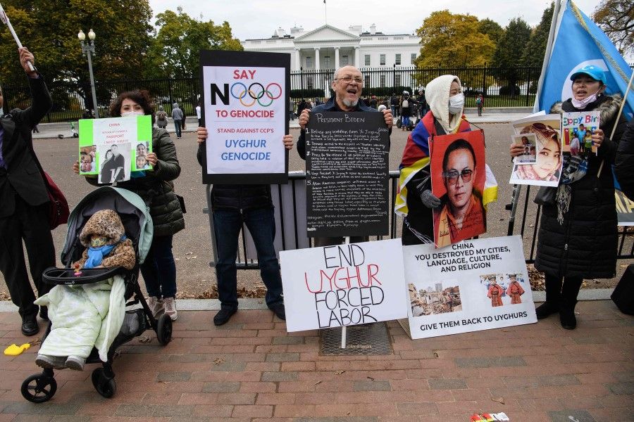 Uighurs, Tibetans, Hongkongers and Taiwanese demonstrators protest in front of the White House in Washington, DC, on 14 November 2021, urging US President Joe Biden to support Human Rights, ahead of his virtual summit with his Chinese counterpart Xi Jinping. (Nicholas Kamm/AFP)