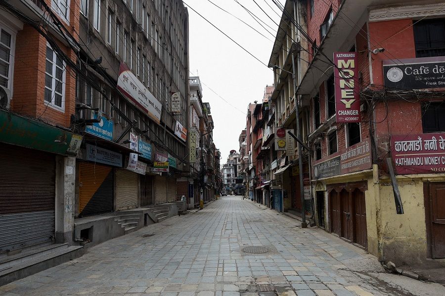 This photo taken on 16 April 2020 shows a deserted street during a government-imposed nationwide lockdown as a preventive measure against the Covid-19 coronavirus in Kathmandu, Nepal. (Prakash Mathema/AFP)