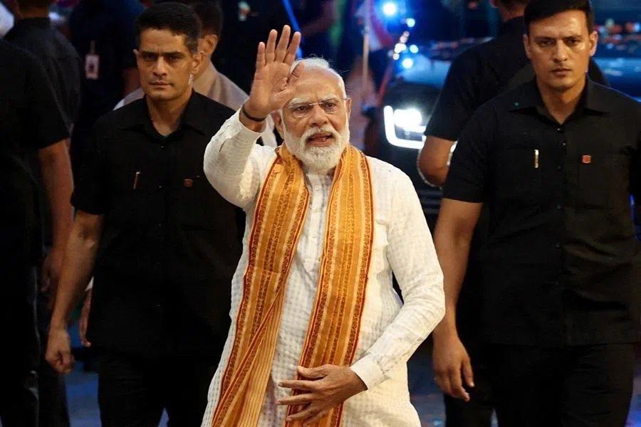 India's Prime Minister Narendra Modi greets his supporters as he arrives at the Bharatiya Janata Party (BJP) headquarters as the BJP won the Assam state assembly election and was on course to win West Bengal, in New Delhi, India, on 4 May 2026.