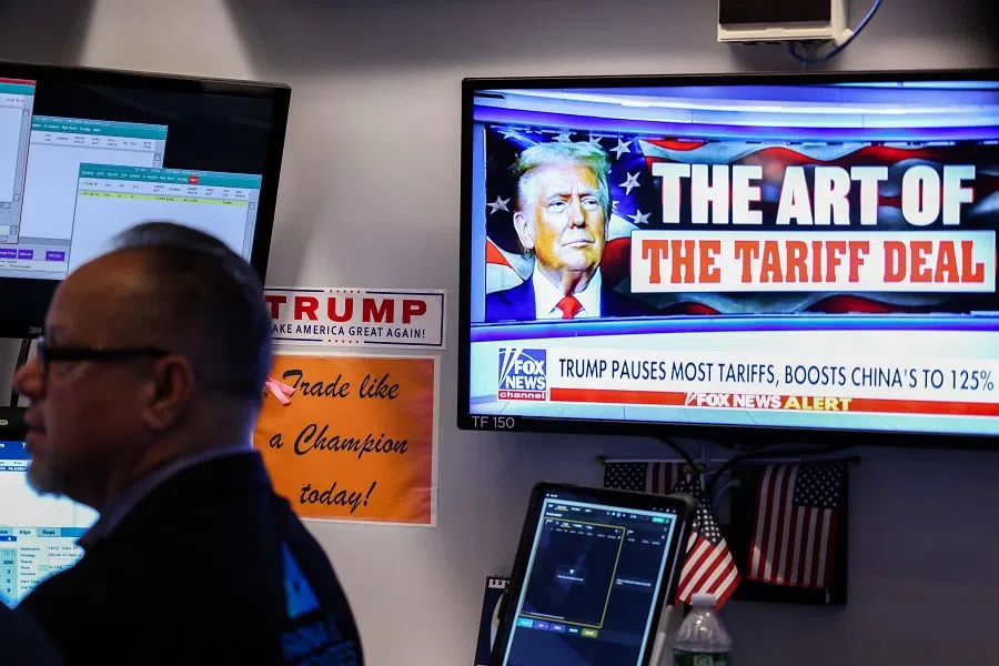 A trader works as a television screen shows news about US President Donald Trump’s trade and tariff policies, on the floor of the New York Stock Exchange (NYSE) at the opening bell on 10 April 2025, in New York City, US.