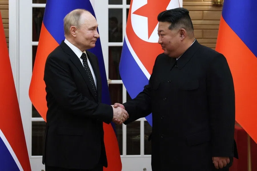 North Korea's leader Kim Jong Un and Russian President Vladimir Putin shake hands after a welcoming ceremony at Kim Il Sung Square in Pyongyang on 19 June 2024.