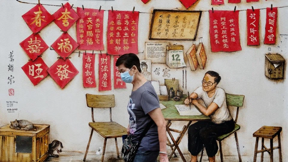 A mural in Chinatown depicting a letter writer. (SPH Media)