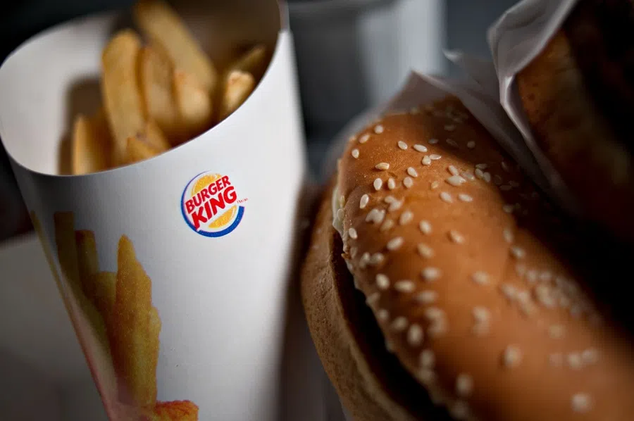 A Burger King Whopper hamburger is arranged with french fries for a photograph taken on 13 February 2013. (Daniel Acker/Bloomberg)