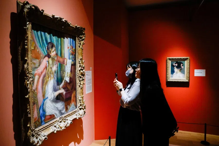 People take photo and view the new exhibition from the New York Met at National Palace Museum in Taipei, Taiwan, on 13 June 2025. (Ann Wang/Reuters)