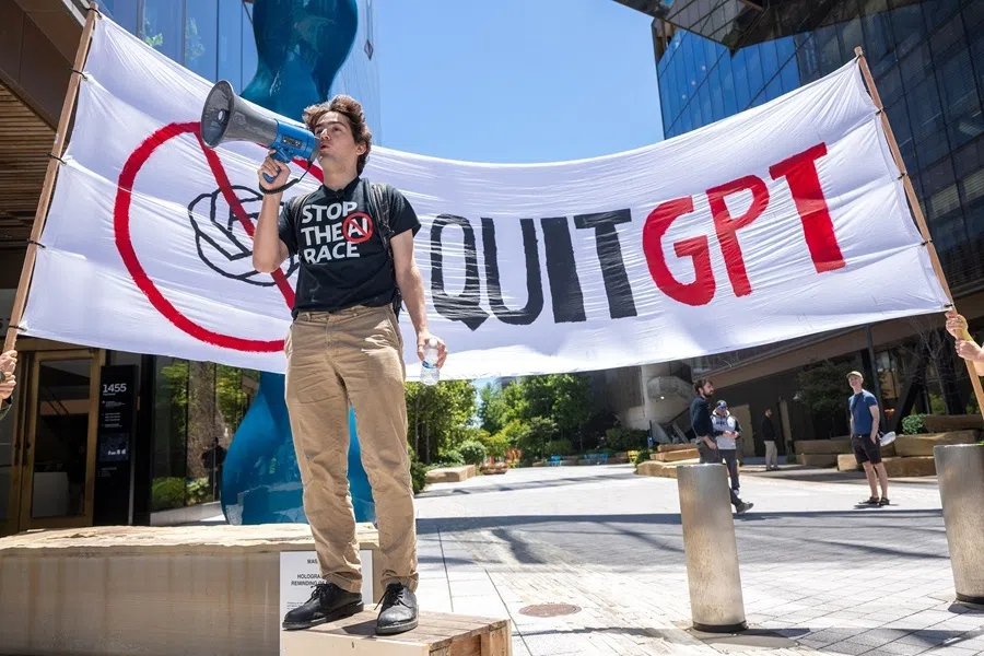 Michael Trazzi, founder and CEO of The Inside View media company producing documentaries about AI Safety, speaks out against the AI race in front of the offices of Open AI during the "Stop the AI Race" protest march in San Francisco, California, on 11 July 2026.