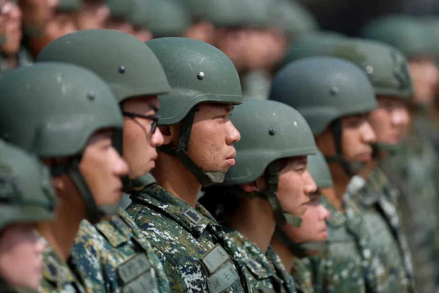 Soldiers stand in formation as Taiwanese President Tsai Ing-wen visits a military base in Chiayi, Taiwan, 25 March 2023. (Carlos Garcia Rawlins/Reuters)