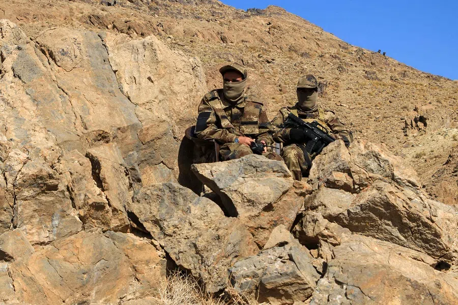 Afghan security personnel guard the inauguration ceremony of an iron ore mine, at Ghurian district in Herat province, Afghanistan, on 9 November 2023. (Mohsen Karimi/AFP)