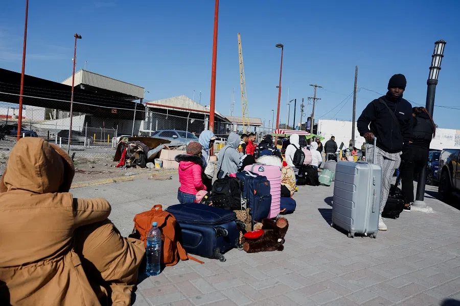Immigrants at the US-Mexico border ahead of US President-elect Donald Trump’s inauguration, in Matamoros, Mexico, on 19 January 2025. (Daniel Becerril/Reuters)