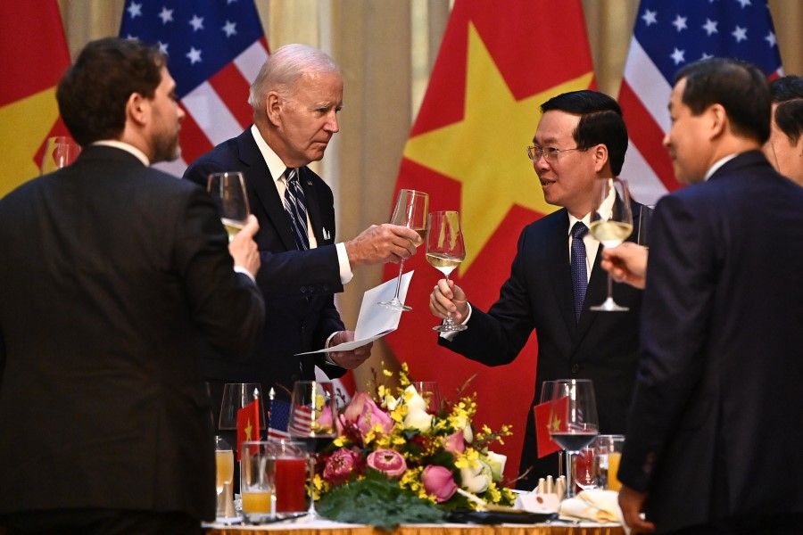 US President Joe Biden (second from left) makes a toast with Vietnam's President Vo Van Thuong (second from right) during a State luncheon at the Presidential Palace in Hanoi on 11 September 2023. (Nhac Nguyen/AFP)