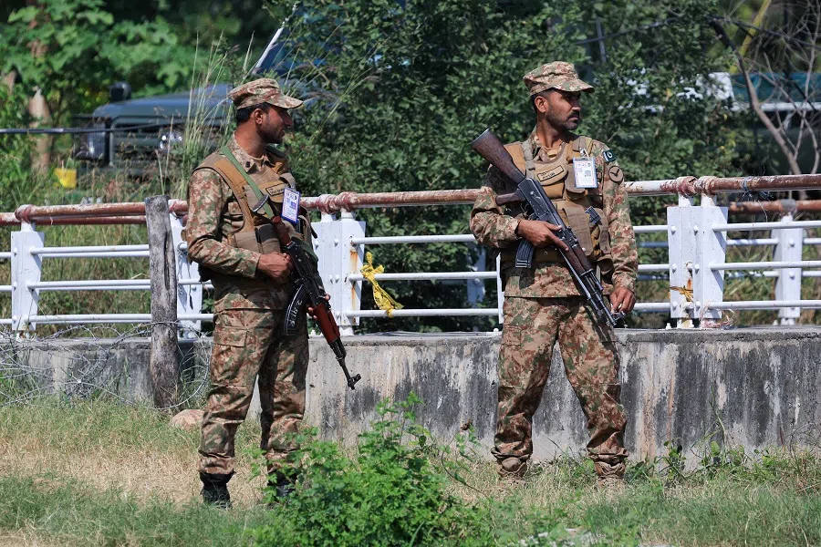 Pakistan Army soldiers stand guard at the Red Zone area, ahead of the arrival of Chinese Premier Li Qiang for a bilateral visit and a heads-of-government gathering of the Shanghai Cooperation Organisation (SCO), in Islamabad, Pakistan, on 14 October 2024. (Akhtar Soomro/Reuters)