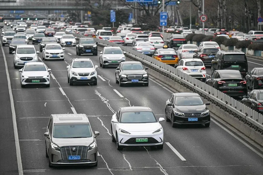 Vehicles make their way on a road during the morning rush hour in Beijing, China on 29 January 2026.