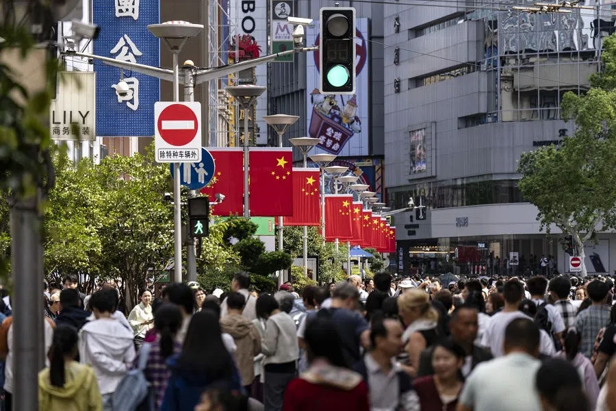 Shoppers on Nanjing East Road in Shanghai, China, 2 October 2024.