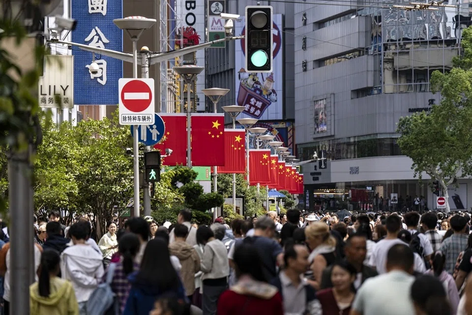 Shoppers on Nanjing East Road in Shanghai, China, 2 October 2024. (Qilai Shen/Bloomberg)