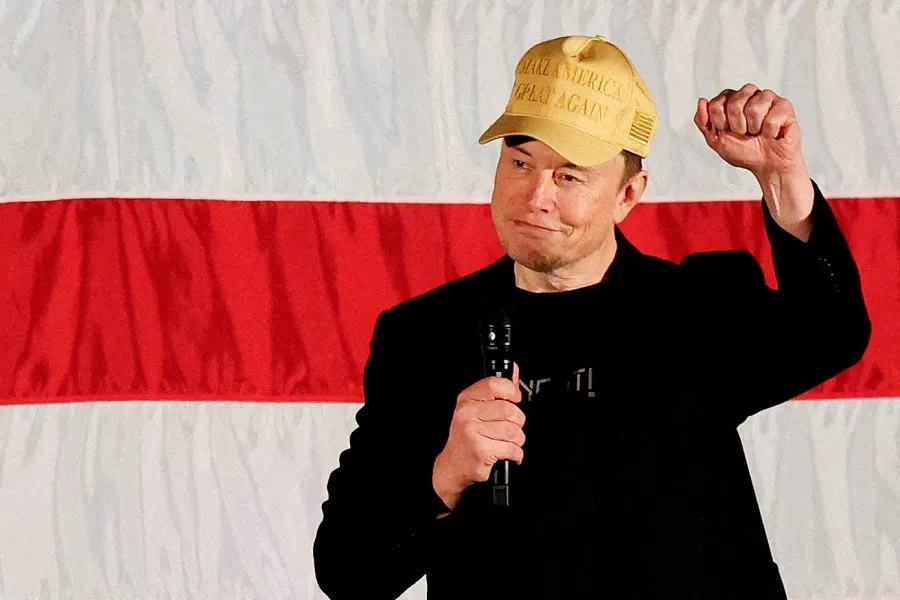 Tesla CEO and X owner Elon Musk, who supports Republican presidential nominee former US President Donald Trump, gestures as he speaks about voting during an America PAC Town Hall in Folsom, Pennsylvania, US, on 17 October 2024. (Rachel Wisniewski/Reuters)