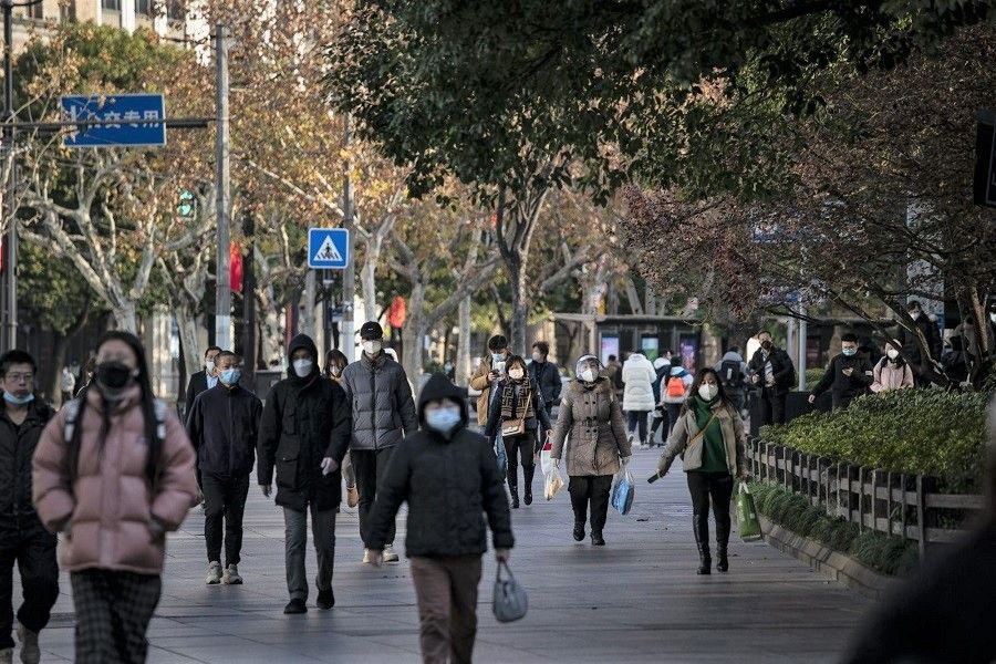 Pedestrians in Shanghai, China, on 3 January 2023. (Qilai Shen/Bloomberg)