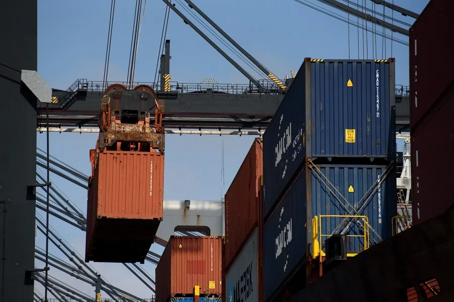A gantry crane moves a shipping container onto a container ship at the Bayport Container Terminal at the port of Houston in Seabrook, Texas, US, on 22 May 2025. (Callaghan O’Hare/Bloomberg)