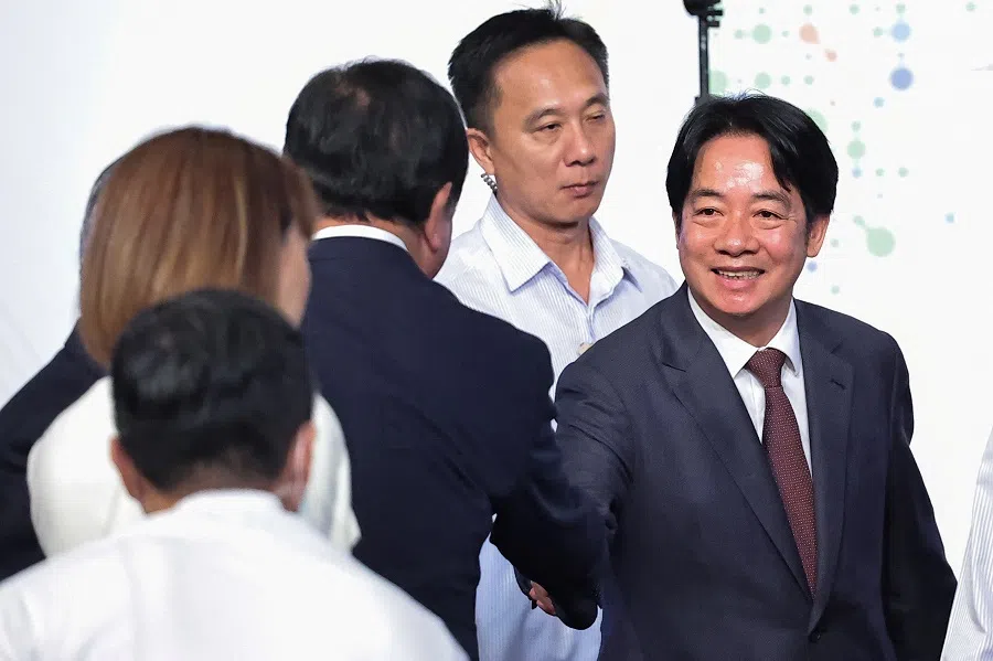 Taiwan’s President Lai Ching-te greets other guests at the annual Ketagalan Forum in Taipei, Taiwan, on 21 August 2024. (Ann Wang/Reuters)