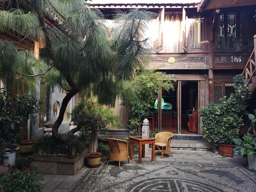 The teahouse is a traditional Naxi-style building.
