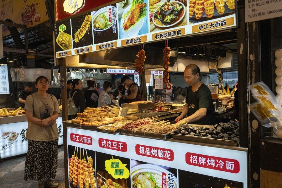 A food stall in Chongqing, China, on 2 May 2024.  (Raul Ariano/Bloomberg)