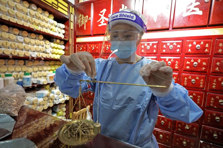 A TCM physician in Singapore preparing Chinese herbs, 5 May 2020. (Wang Hui Fen/SPH)