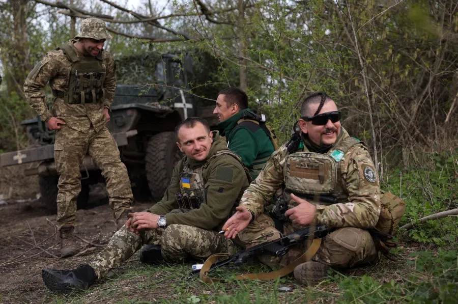 Artillerymen of Ukrainian 80th separate airborne assault brigade, rest on the front line near Bakhmut in Donetsk region on 18 April 2023, amid the Russian invasion of Ukraine. (Anatolii Stepanov/AFP)