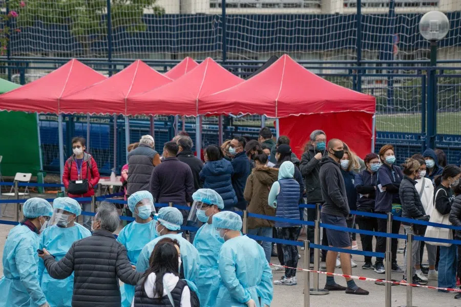 Residents wait in line at a Covid-19 testing facility in Discovery Bay on Lantau Island in Hong Kong, China, on 9 February 2022. (Bertha Wang/Bloomberg)