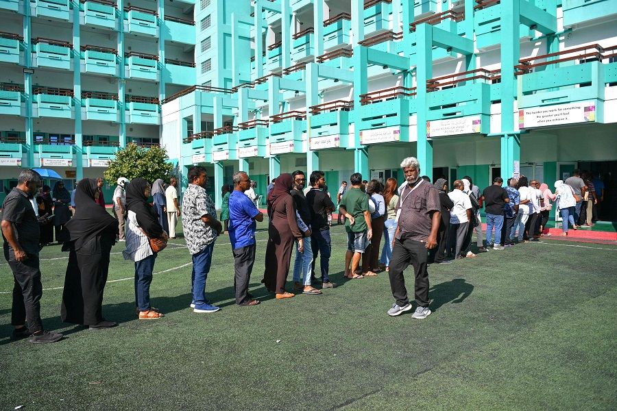 Voters stand in queue as they wait to cast their ballot during Maldives' presidential election in Male on 9 September 2023. (Mohamed Afrah/AFP)