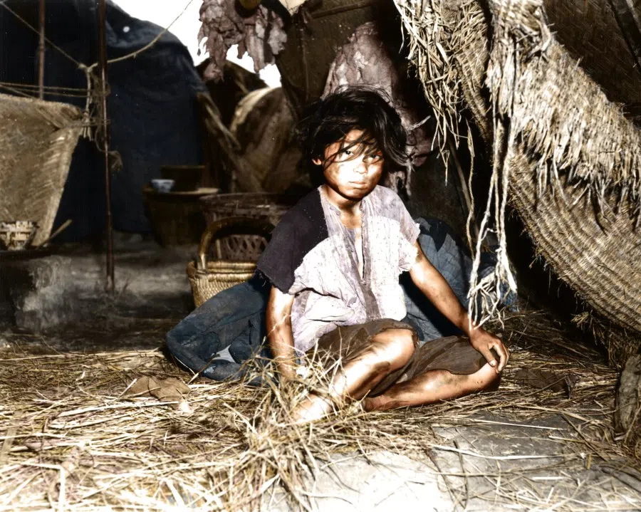 1948: Young village girls in Nanjing living in run-down tents. The civil war raged in northeast and northern China, leading to many refugees fleeing to the cities.