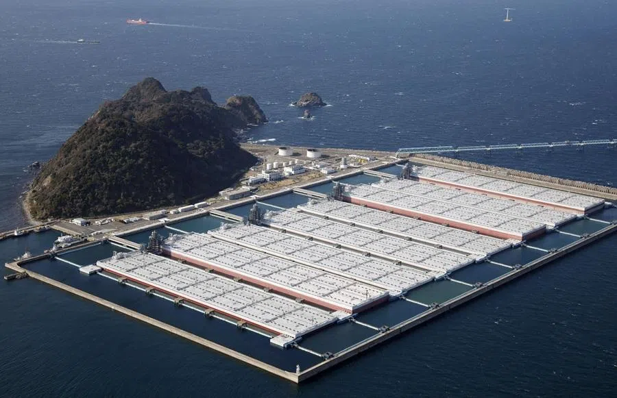 An aerial view shows the Shirashima National Petroleum Stockpiling Base in Kitakyushu, southwestern Japan, on 12 March 2026, in this photo taken by Kyodo. (Kyodo via Reuters)