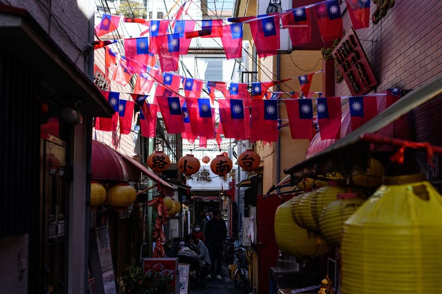 Amid tough battling between China and Taiwan in containing the Covid-19 outbreak, China is not changing its stance towards Taiwan. This photo taken on 23 February 2020 shows Taiwan flags hung along a street in the Chinatown district in Yokohama. (Philip Fong/AFP)