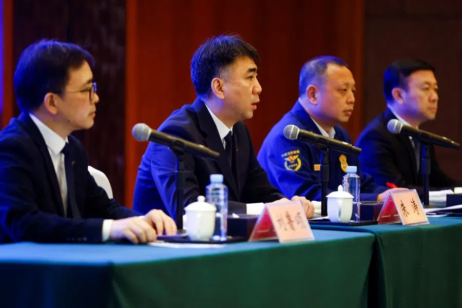 Officials of the Civil Aviation Administration of China (CAAC) at a news conference after a China Eastern Airlines Boeing 737-800 plane flying from Kunming to Guangzhou crashed, in Wuzhou, Guangxi Zhuang Autonomous Region, China, 24 March 2022. (Carlos Garcia Rawlins/Reuters)