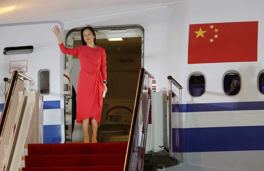 Huawei Technologies Chief Financial Officer Meng Wanzhou waves as she steps out of a charter plane at Shenzhen Baoan International Airport in Shenzhen, Guangdong, China, 25 September 2021.