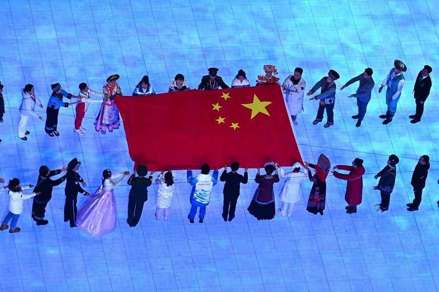 The inclusion of the hanbok as one of the costumes donned by performers carrying China's national flag during the opening ceremony of the Beijing 2022 Winter Olympic Games drew ire. (Antonin Thuillier/AFP)