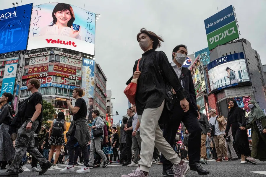 People cross the street at Shibuya Crossing in central Tokyo on 6 November 2023. (Richard A. Brooks/AFP)