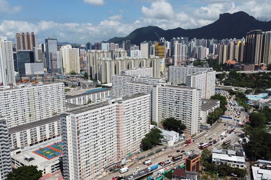 An aerial view shows Choi Hung public housing estate and other residential buildings with the Lion Rock peak in the background, in Hong Kong, 3 June 2021. (Joyce Zhou/Reuters)