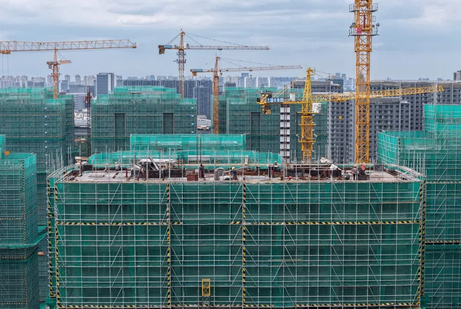Workers are seen on a residential construction site in Hangzhou, Zhejiang province, China, on 15 July 2025. (AFP)