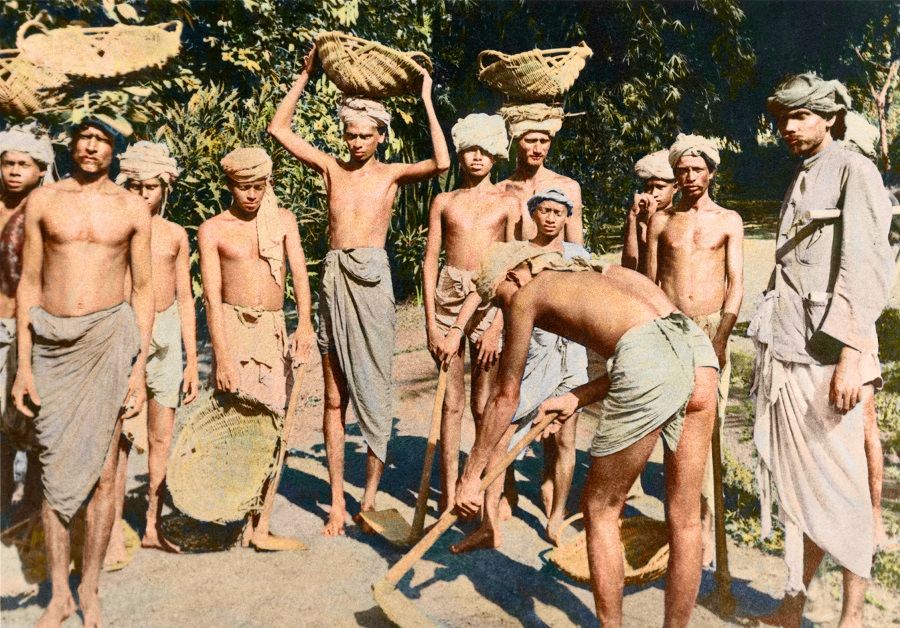 Coolies from India, 1900s. They worked mainly in goods transportation, construction and rubber tapping, and migrated for similar reasons to the Chinese, as part of the British empire's opening up of colonial economies.