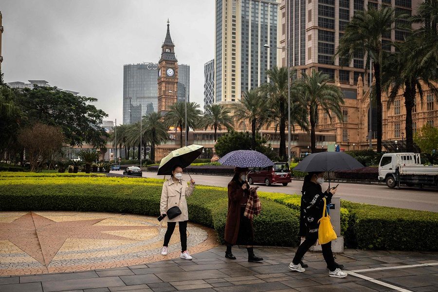Visitors walk on the Cotai strip in Macau, China, on 16 December 2022. (Eduardo Leal/AFP)