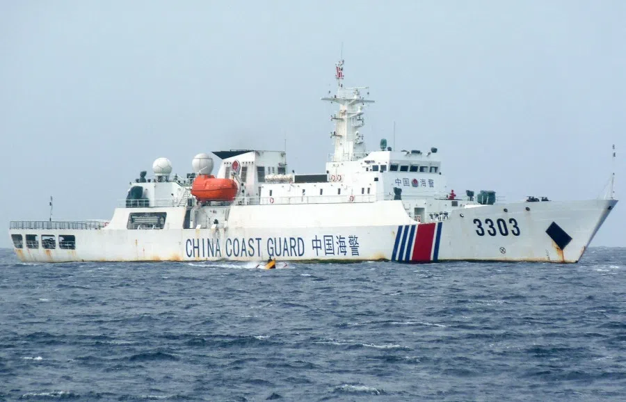 In this photo taken on 25 December 2022, a Chinese coast guard ship patrols Scarborough Shoal in the South China Sea. (AFP)